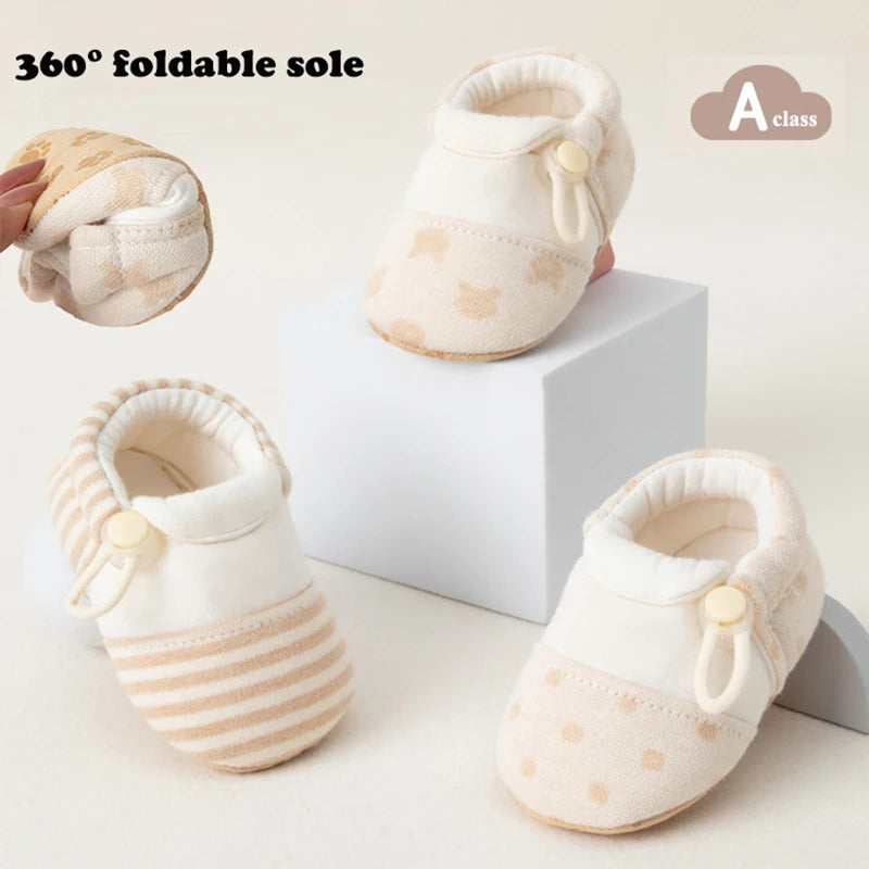 Baby shoes with a foldable sole on a white background