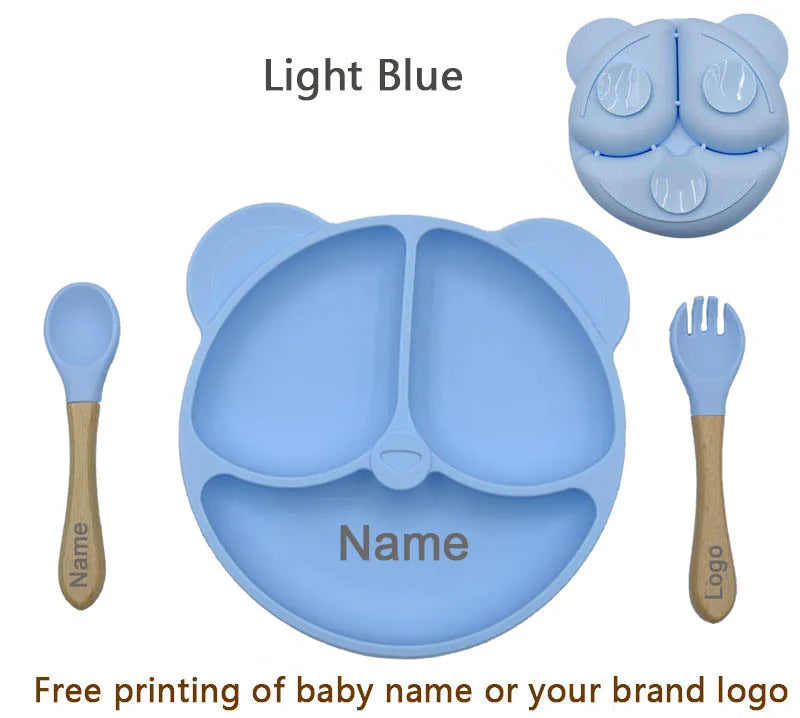 Light blue children's dining set with bowl, spoon, and fork on a white background.