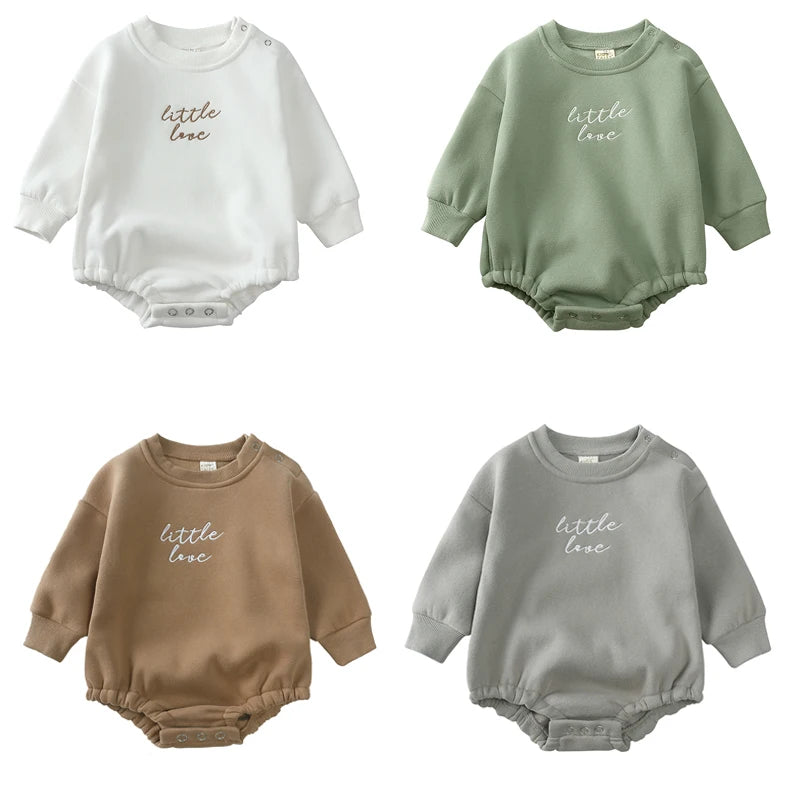 Four baby rompers in different colors with 'little love' text on a white background