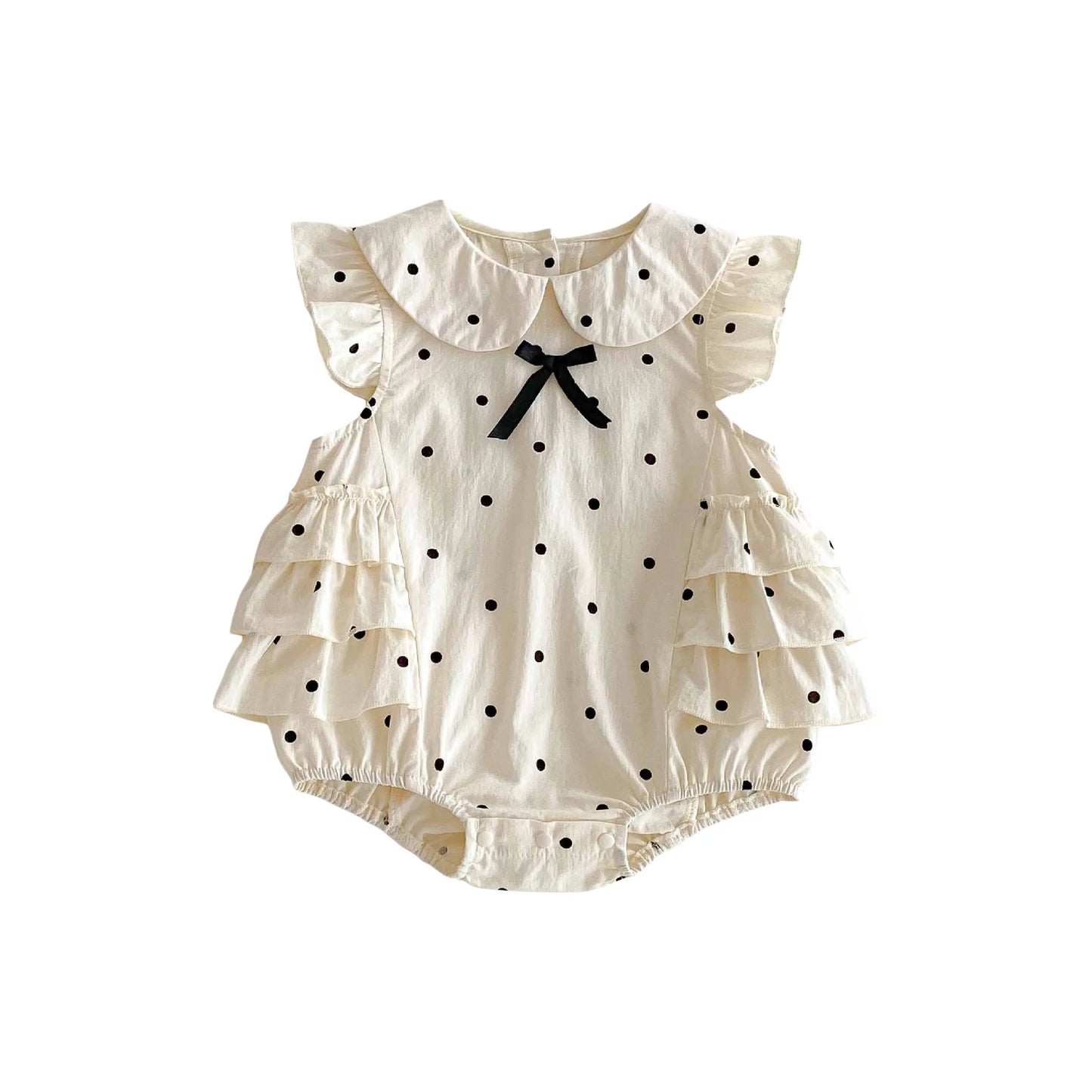 Baby romper with polka dots and ruffled sleeves on a white background