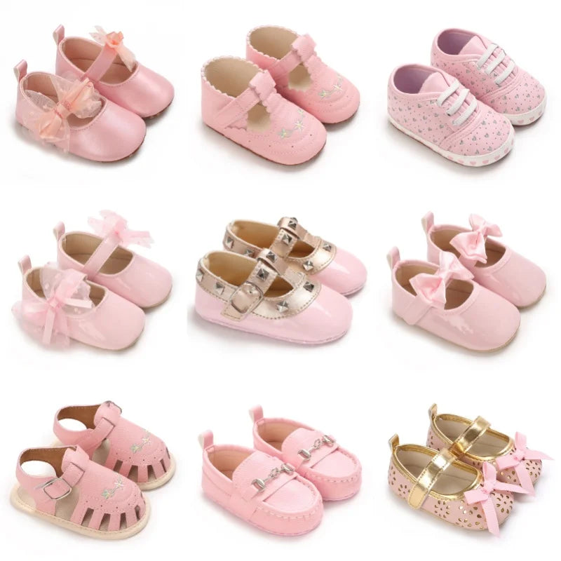 Collection of pink baby shoes with various designs on a white background