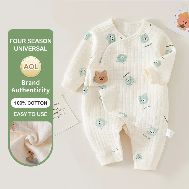 Baby romper with bear pattern on a light background, featuring brand authenticity and cotton content text.