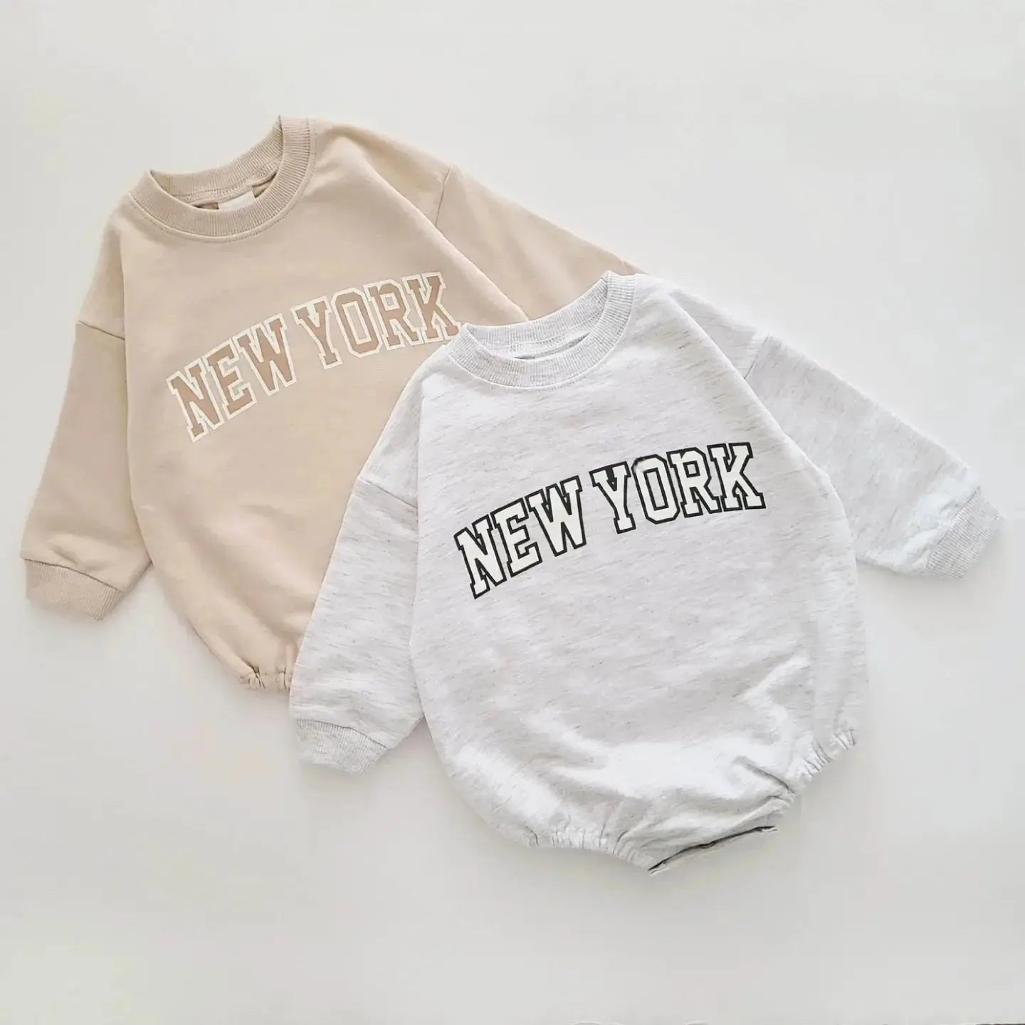 Two sweatshirts with 'New York' text on a light background