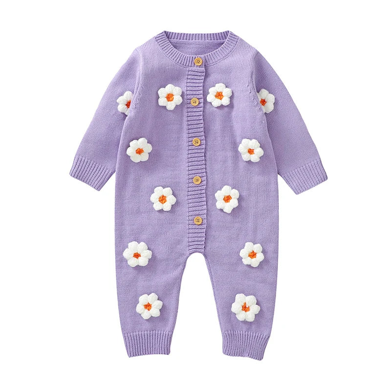 Purple baby romper with floral designs on a white background