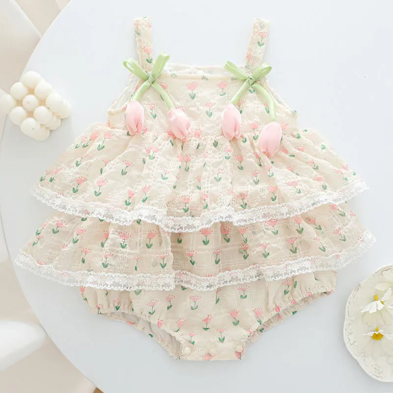 Baby dress with floral pattern on a white surface