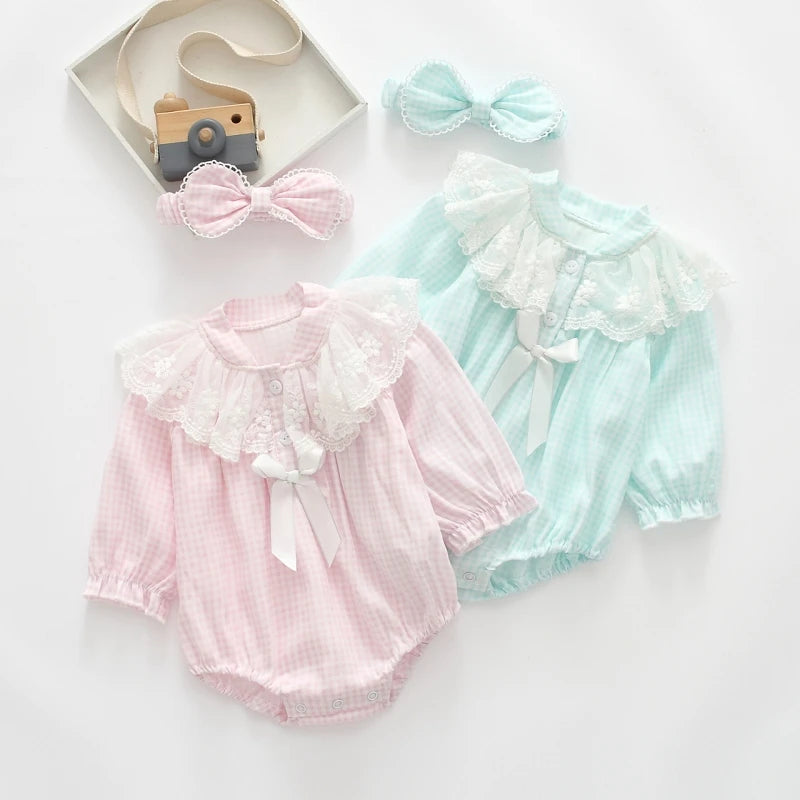 Two baby rompers, one pink and one blue, with matching bows on a white background.
